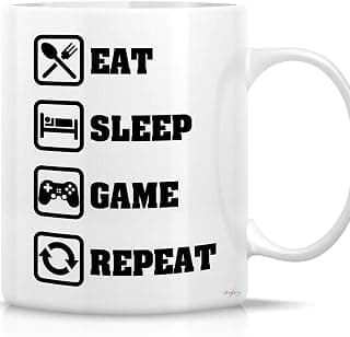 مج قهوة سيراميك بطبعة عبارة «Eat Sleep Game Repeat» سعة 325 مل، لون أبيض، تصميم لمحبي الألعاب